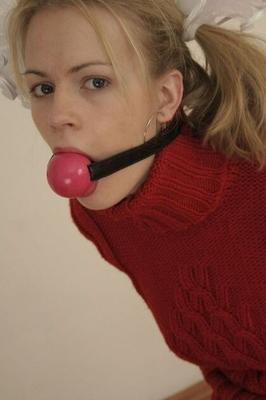 Woman ballgagged