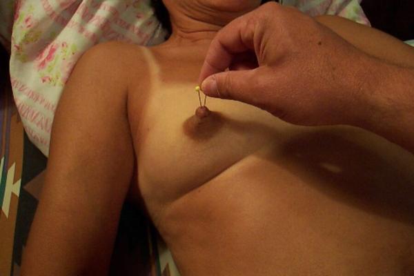 NIPPLE TORTURING A WHORES TITS WITH PINS DEEP