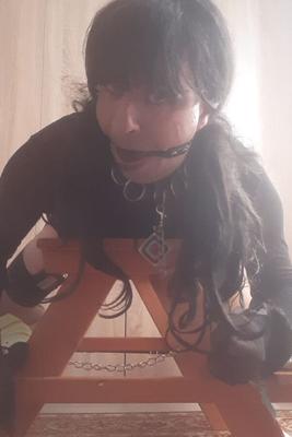 Sissy Jane bound on a wooden pony