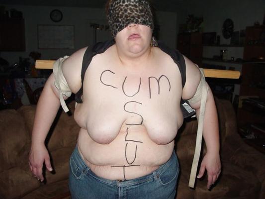 Fat pig slave with body writing