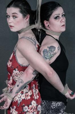 two goth girls tied and forced together