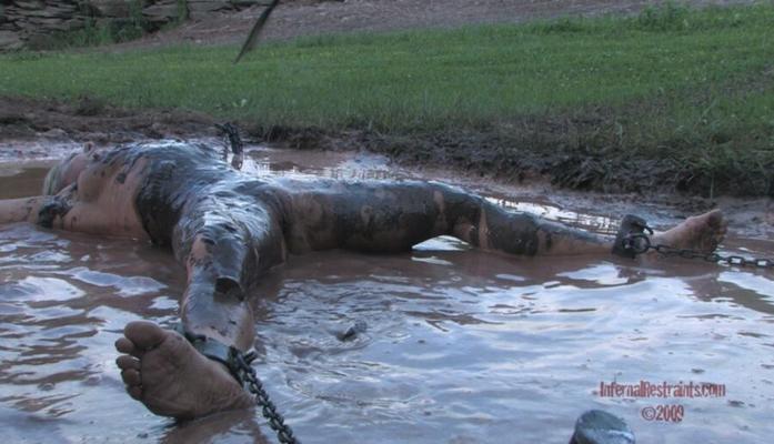 Outdoor bondage in mud