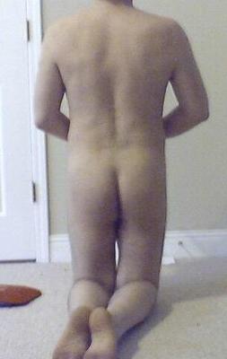 nude submissive male kneeling