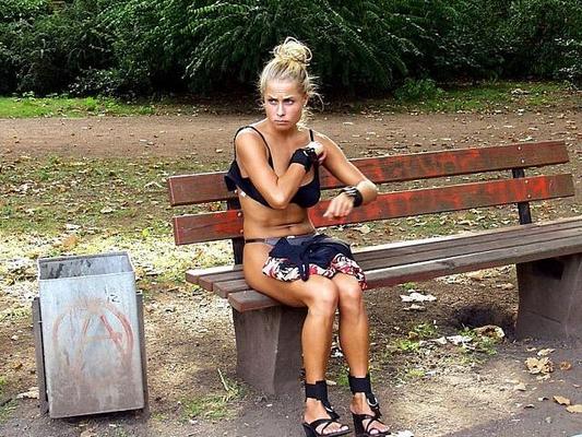 Exposed nude on a park bench